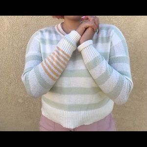 orange and green striped sweater